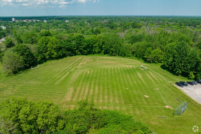 Holy Cross Academy features a large sports field for student activities.