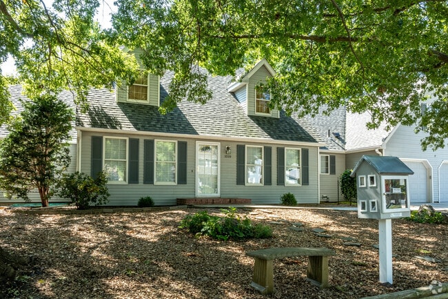 Large trees provide shady yards and sidewalks for the homes of Ty N Cae.