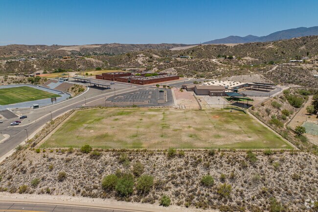 Scenic mountain views frame the grounds of Dr. Charles A. Bejarano Elementary School, enhancing its peaceful setting.