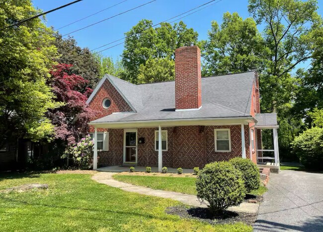 Front of home, apartment entrance is located at rear of home