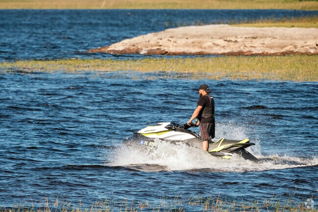 Neo City residents enjoy the adrenaline rush of jet skiing on nearby Lake Toho.