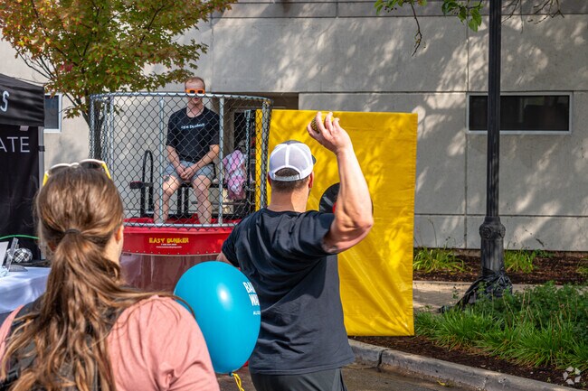 A man takes aim at the dunk tank at Heritage Fest near East Dundee.