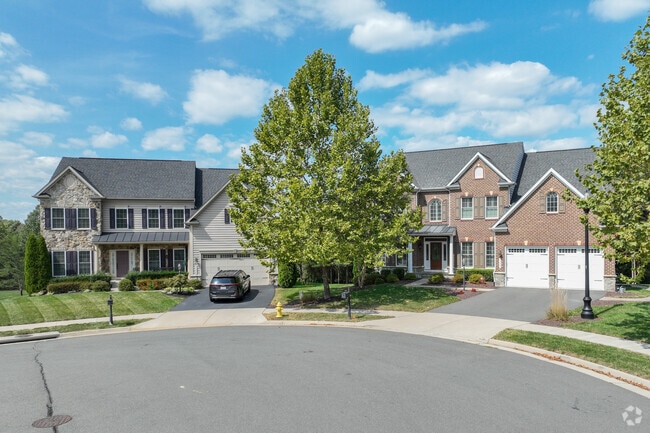 Stylish colonial brick homes with creative landscaping on a quiet cul-de-sac in Wellington.