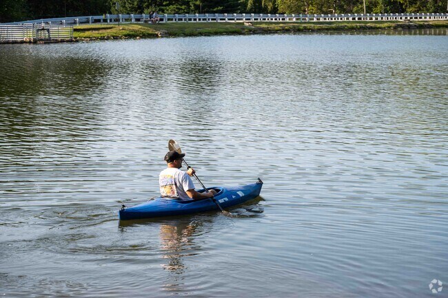 The Lake of the Woods Preserves has a beautiful lake where people enjoying canoeing.