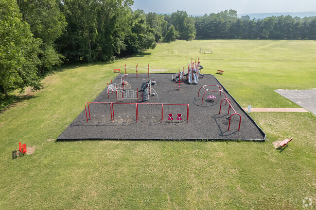 Lynnwood Elementary School playground has chairs on each corner to observe kids from a distance.