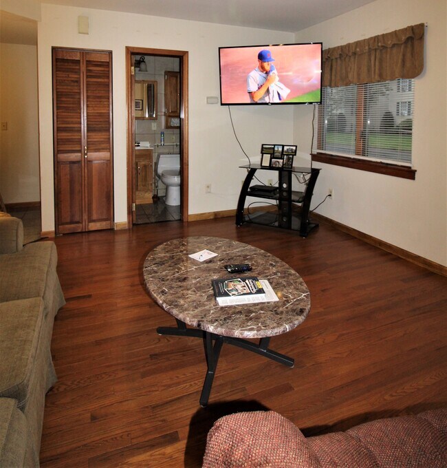 New hardwood floors and large flat screen TV