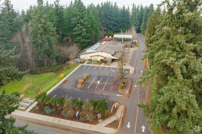 Cascadia School is surrounded by tower fir trees in Vancouver, Washington.