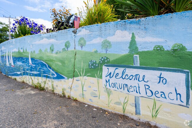 Monument Beach glows in the afternoon sun, offering a quiet escape in a beautiful neighborhood.