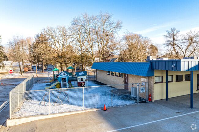 Children enjoy playing on the playground at the Kinder Center.