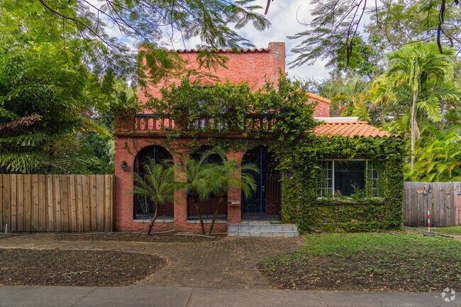 The tropical landscape of the Design District grows deep on this Spanish influenced home.