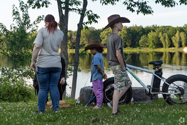 Families enjoy time along the Penobscot River near Bradley.