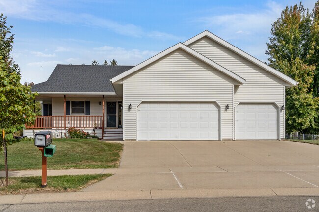 South Pointe Drive features spacious split-level homes with modern siding and large garages.