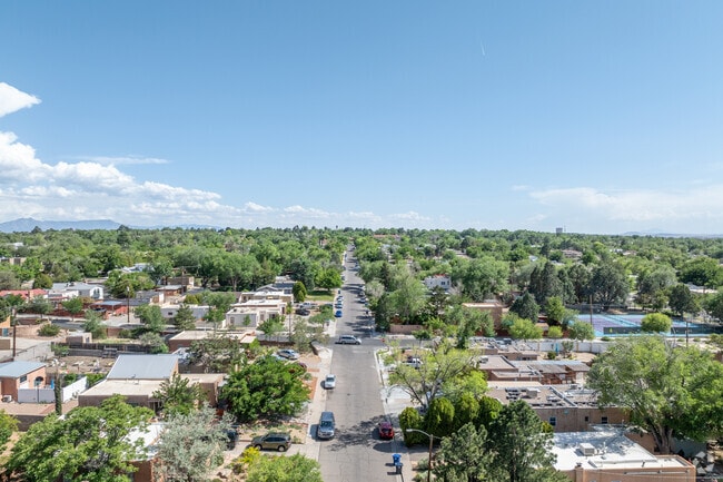 University Heights stretches west with tree-lined streets and vibrant rooftops.