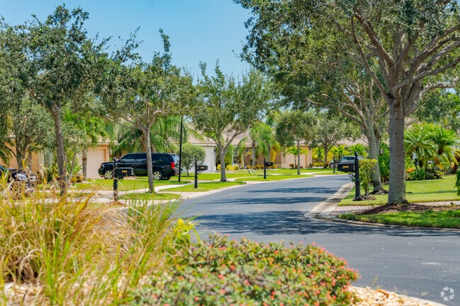 The residential streets in Sawgrass Lakes are tree lined with paved sidewalks.