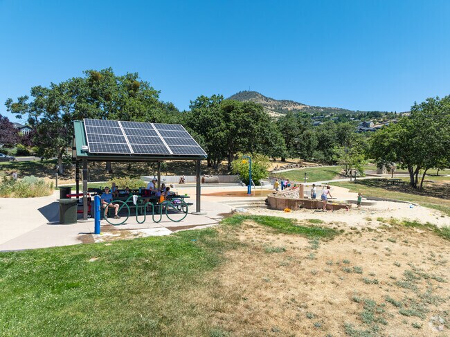Families enjoy Oregon Hills Park an energy sustainable park with solar panels that power it.