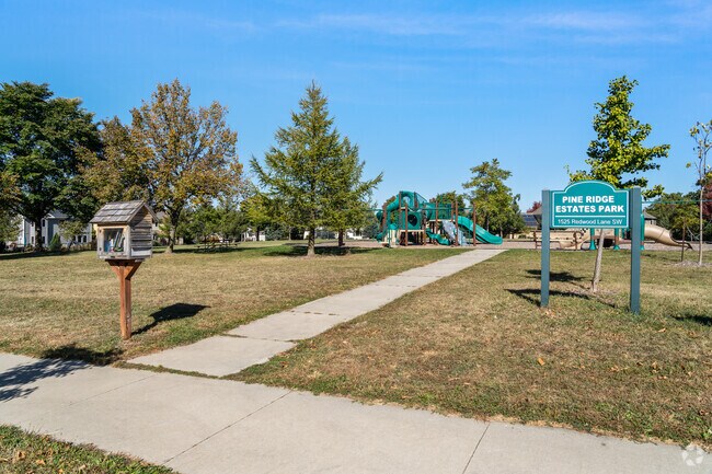 Pine Ridge Estates Park features a playground and a little library for all ages to enjoy.