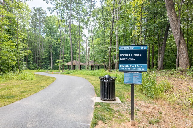 Idlewild Road Park offers the Irvins Creek Greenway for the trail hiker in Becton Park.