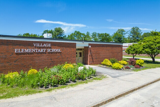 Side entrance and building sign on the Village Elementary School.