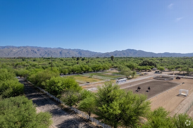 Two horseback riders at DeCesari Equestrian in the Houghton neighborhood.