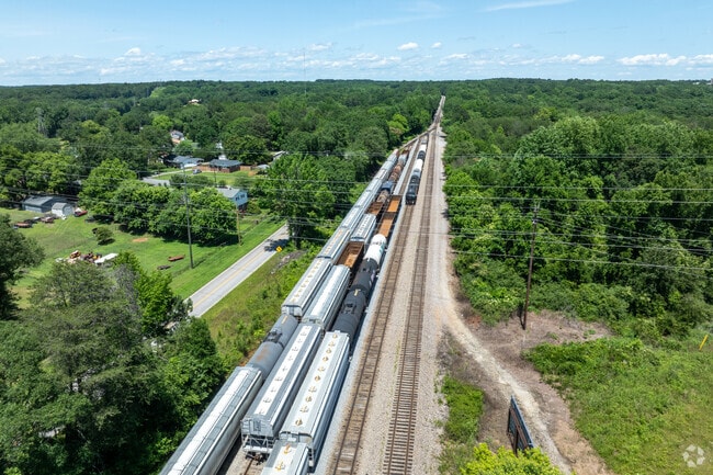 The old railroad tracks border Beaumont Village on one side and lead past converted mills.