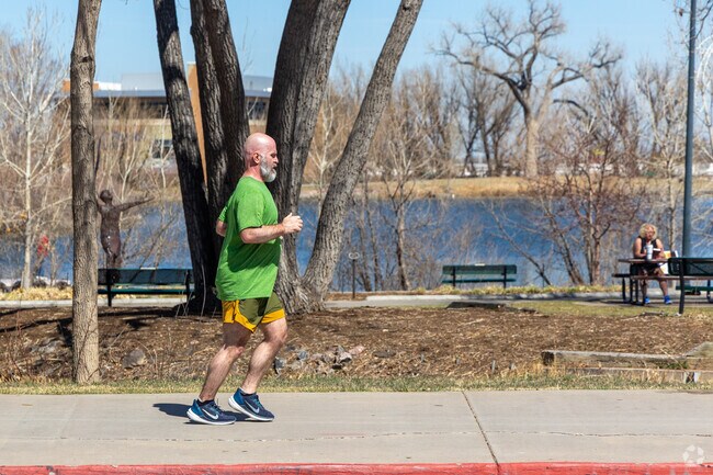 Hillcrest neighbors run the Webster Lake path at E.B. Rains Jr. Park.