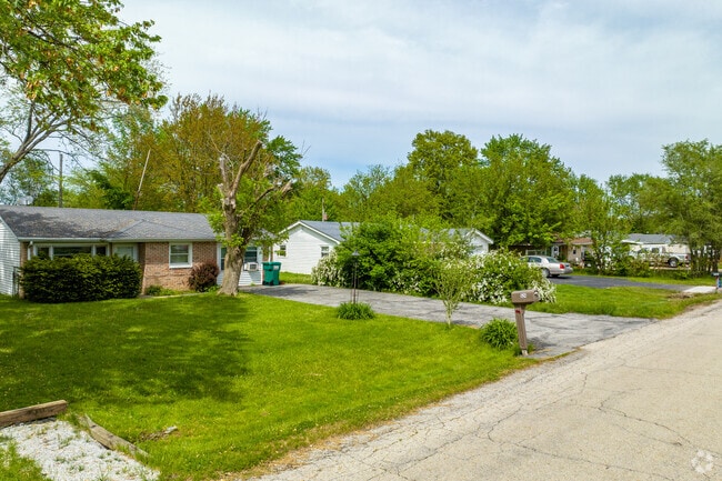 Ranch homes with big yards and private driveways are common in Goodenow.