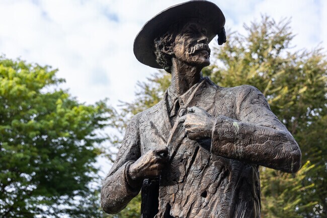 James McNeill Whistler was a painter and etcher and you can see a statue of him at Whistler park