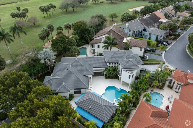 Most homes in Boca Pointe feature backyard pools.