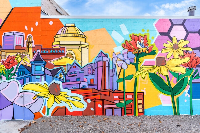 A bright mural adorns the side of a building downtown in the Vassar Park neighborhood.