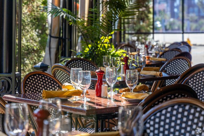 Via Italian Table's patio seating area with rays of afternoon light in the Bell Hill area.