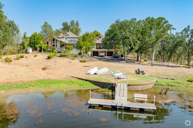 Large custom home on fishing pond gives this Centerville family easy access to the water.