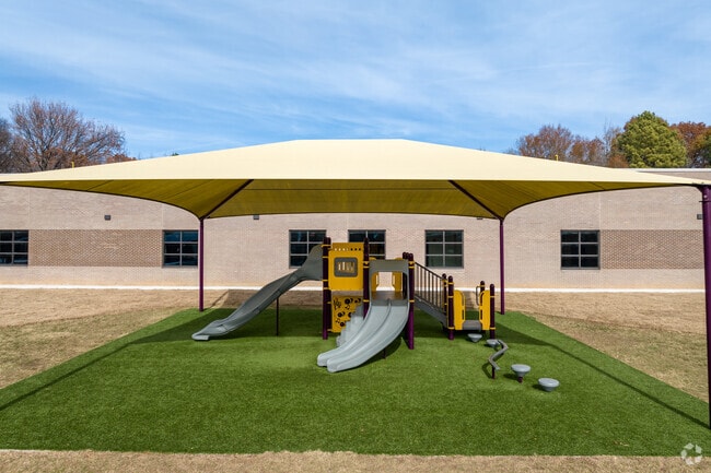 Kids can stay cool on the shaded  playground at Geeter School in Memphis.