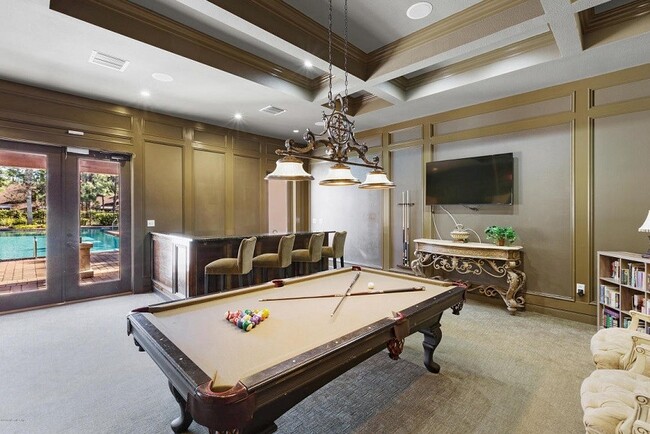 Shoot a game of pool overlooking the pool!