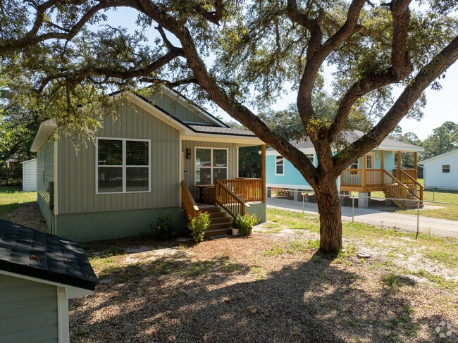 Live oak shade frames new cottages in Lanark Village on Florida’s Forgotten Coast.