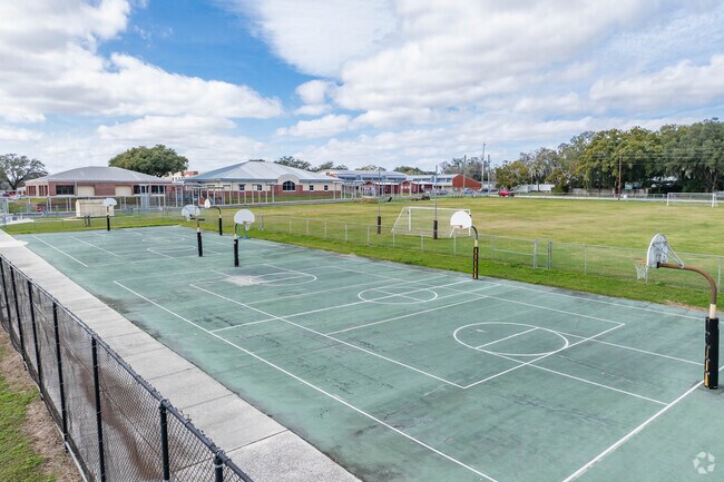 Students enjoy outdoor play on the sports courts at Stewart Middle School.