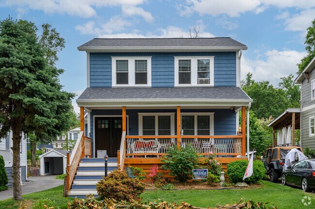 Many two-story homes in Aurora Highlands have large front porches.