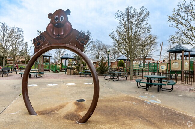 Also none as Cedarhurst park, kids can play on the swing sets or run through the sprinklers during Summer time