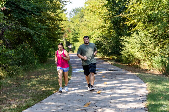 A couple takes an afternoon run along the Legacy Trail in The Crossing.