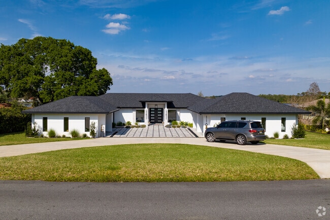 Many homes in Cypress Gardens have delightful front porches and a wrap-around driveway.