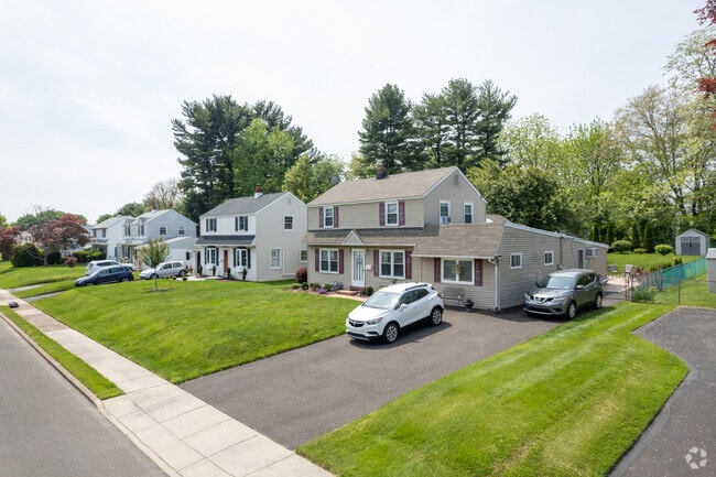 Colonial homes line wide sidewalk streets in Warminster Township.