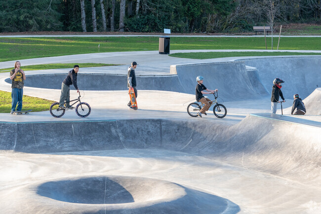 Children and Adults enjoy the skate park and bike trails at Base Camp Skate Park.