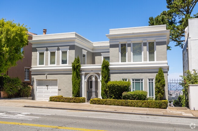 Clarendon Heights homes sit on a hillside with city views.