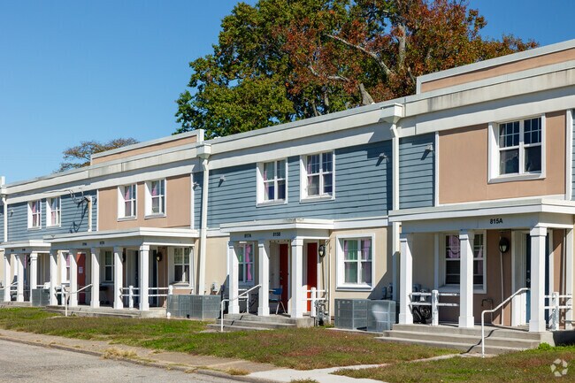 A row of colorful apartment homes can be seen in Huntington
