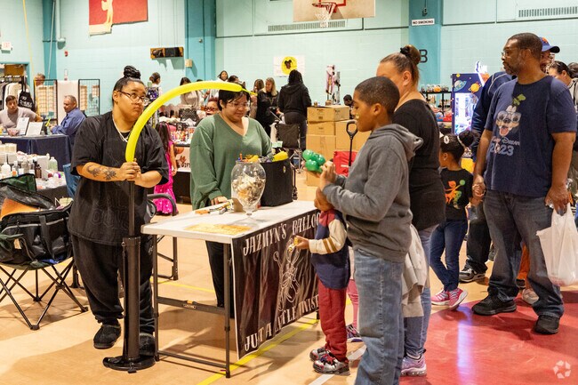 A creative balloon maker keeps vistors to the Freeport Halloween Family Festival entertained.