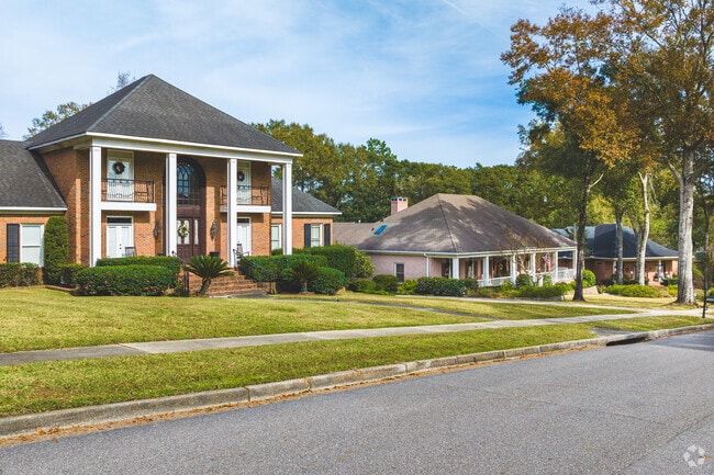 Milkhouse features larger Colonial Style homes with French-inspired roofs.