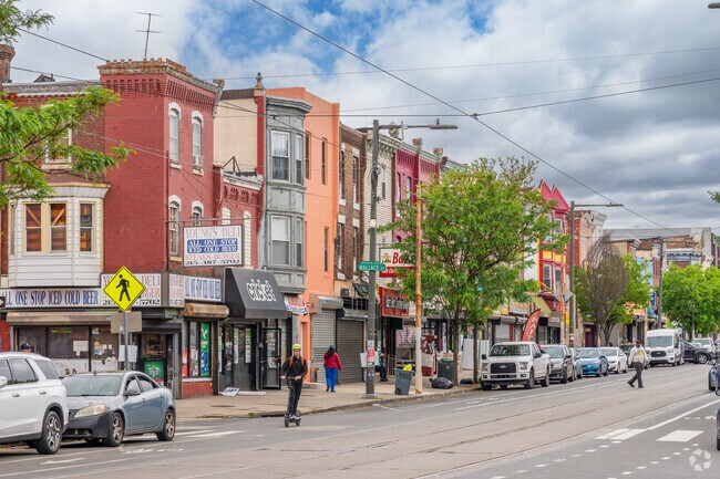 Shop and dine at bustling businesses along Lancaster Ave in Mantua.
