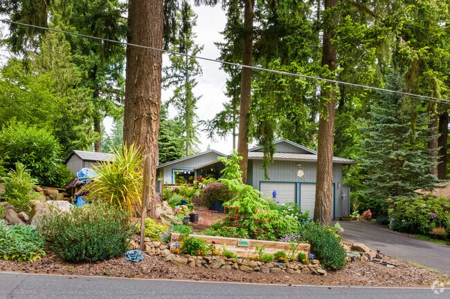 Front yard decorations and fir trees frame a ranch home in the Rosewood Neighborhood.