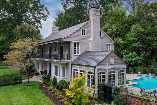 Home in Windsor Farms designed with an American Townhome style reminiscent of Bourbon Street.
