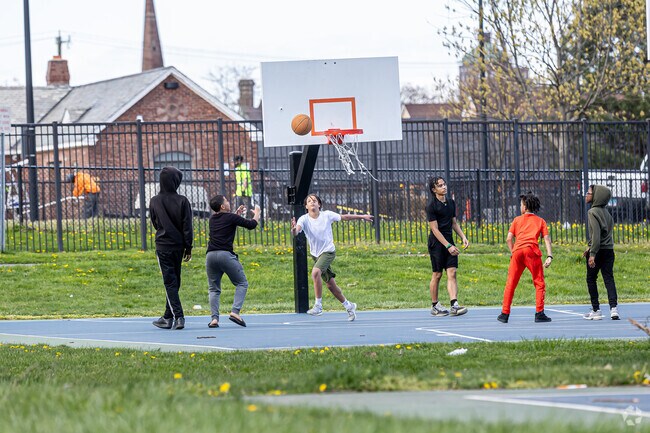 Sheldon Charter Oak locals meet up in Colt Park for a game of basketball.