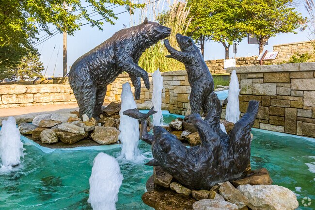These bears sit playing at the Merriam Visitors Center of Shawnee Mission Parkway.
